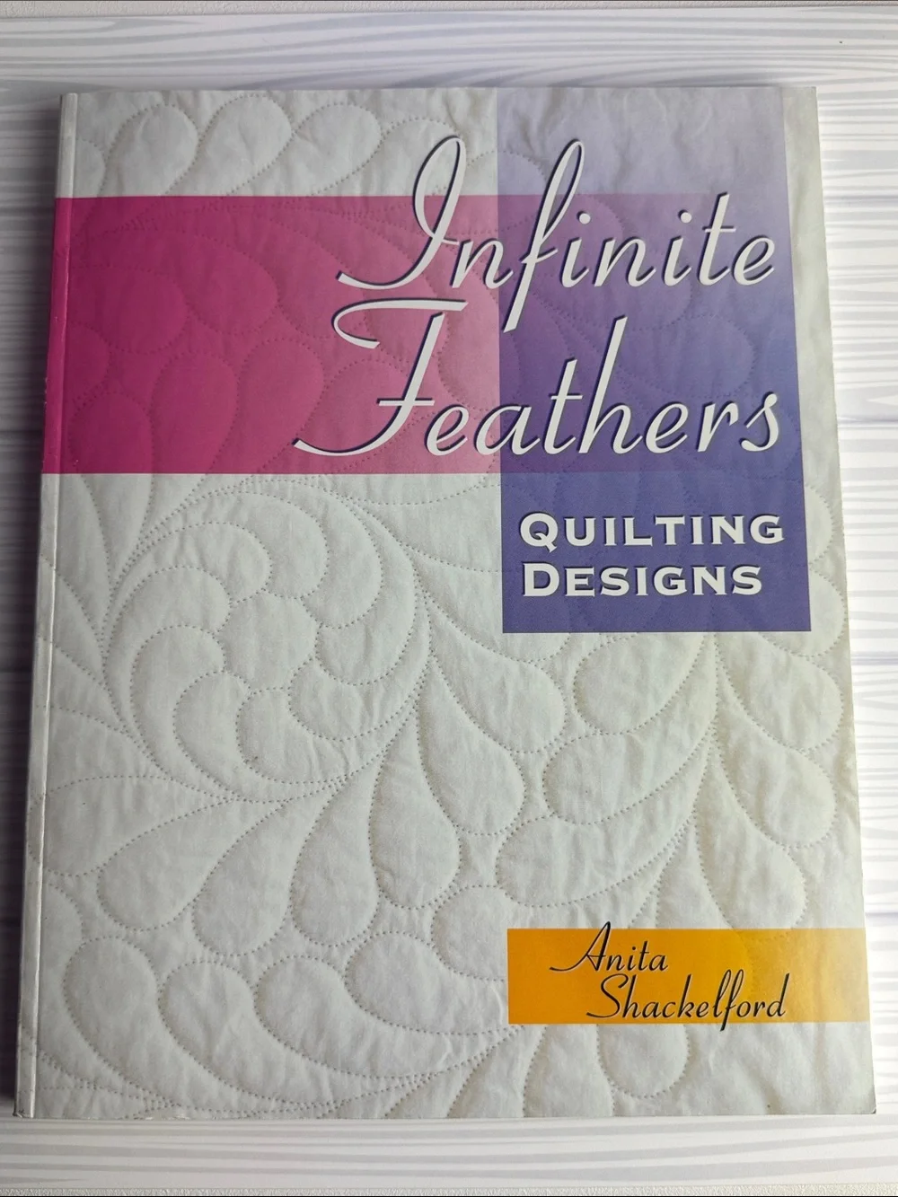 Infinite Feathers Quilting Designs - White with Pink & Purple Accents
